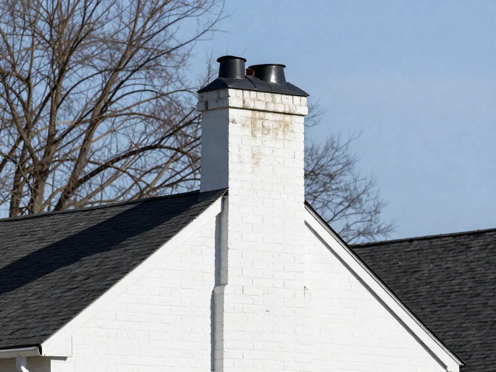 Brick chimney on a home served by Charlton Bros Chimney Services in Philadelphia, PA